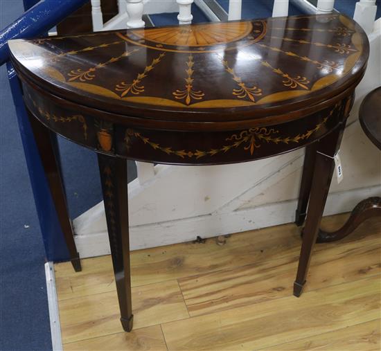 A George III marquetry inlaid mahogany card table, W.92cm